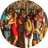 a group of people standing in front of a crowd posing for the camera